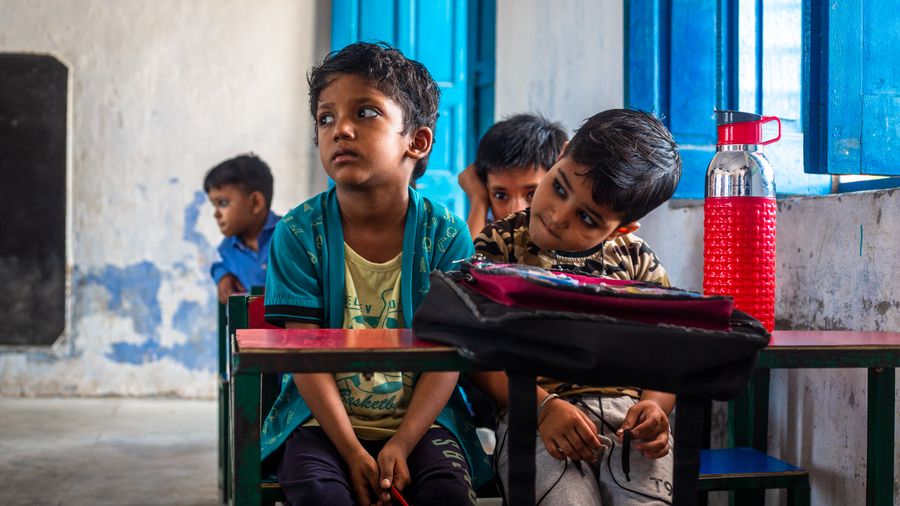 Indian children learning together in a classroom