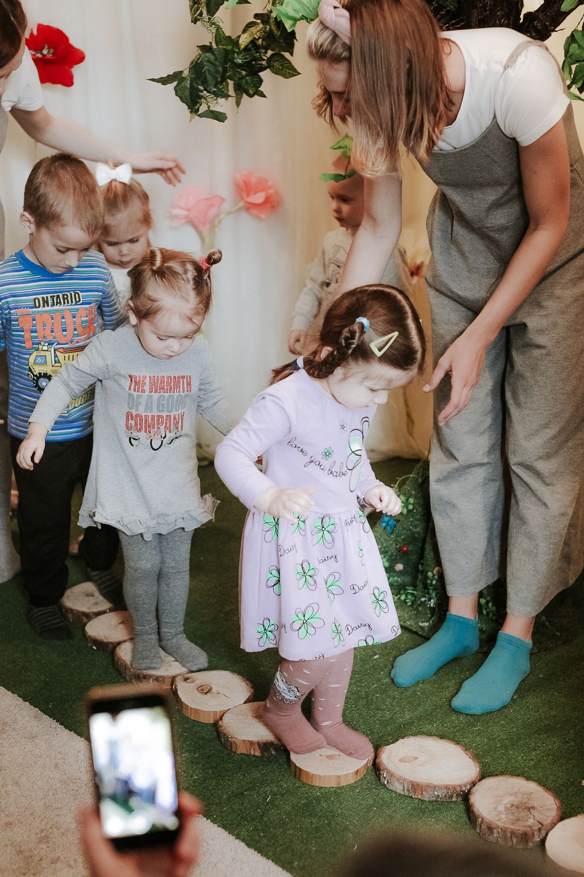 Young children taking part in a guided early-learning activity