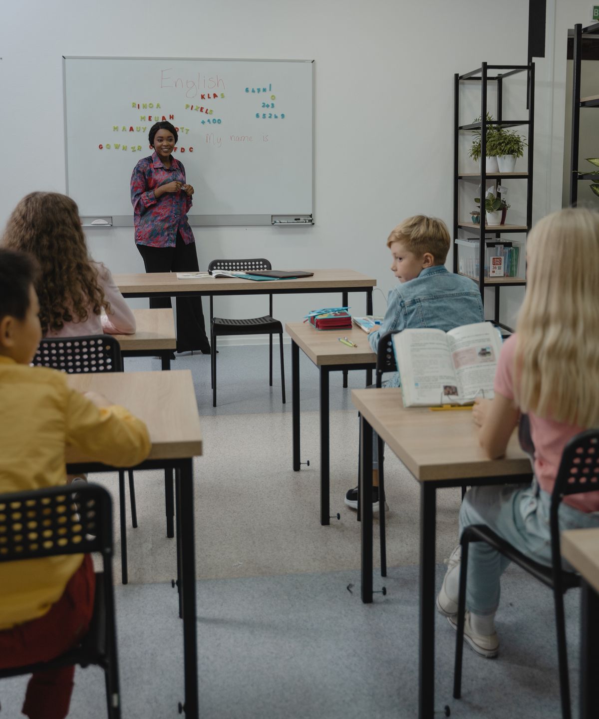Teacher supporting children in an inclusive special-education class