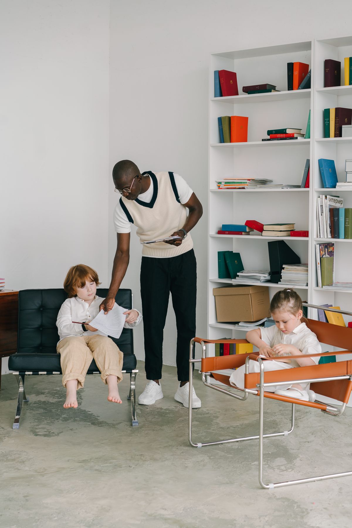 Therapist supporting children during a speech-therapy session